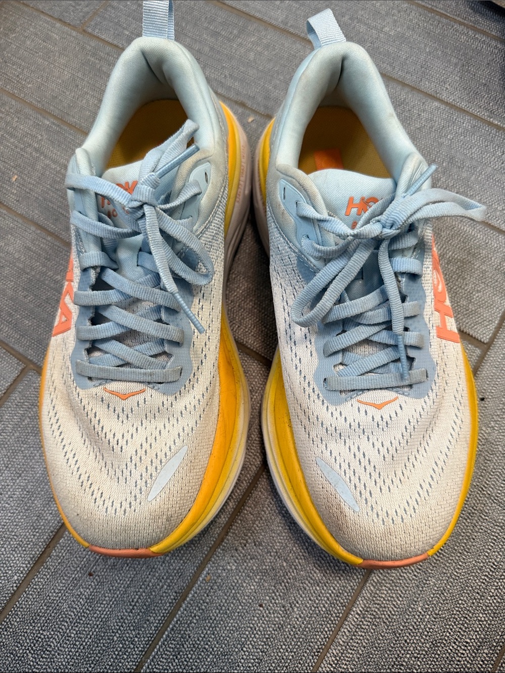 Hoka Light Blue and Yellow Running Shoes with Orange Logo